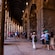 Guests walking through the passageway inside the arched entrances of the Colosseum in Rome, Italy
